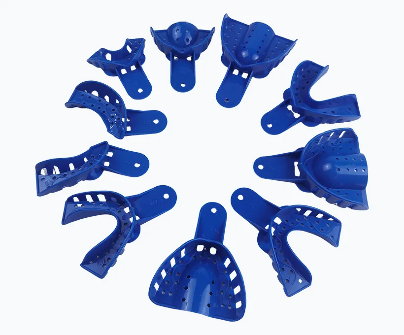 Blue plastic perforated impression trays showing maxillary and mandibular designs for alginate material compatibility